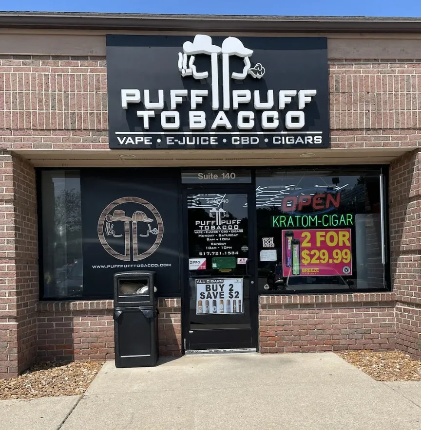 Brick Puff Puff Tobacco storefront with illuminated open sign